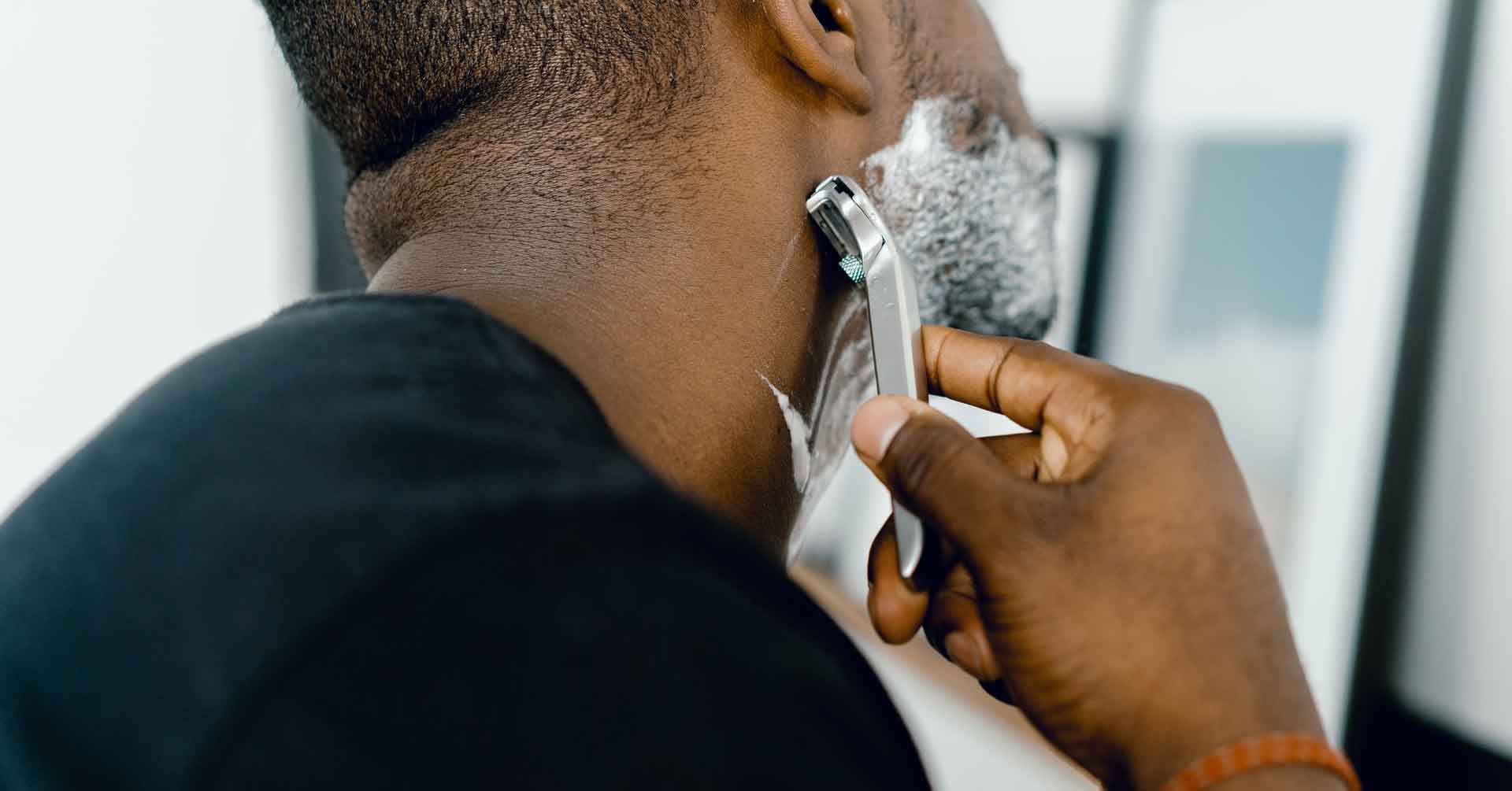 Man shaving his beard