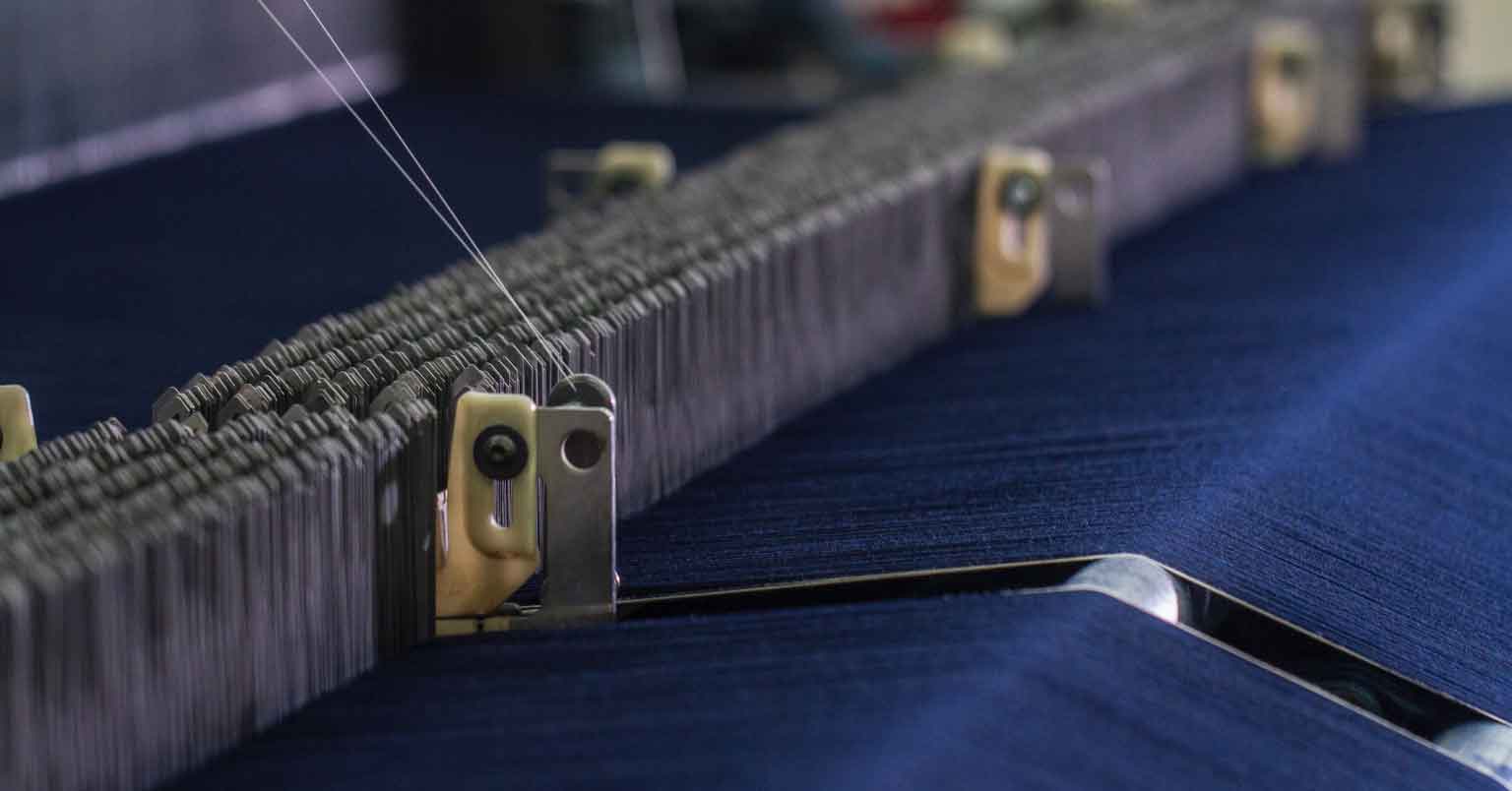 Jeans being weaved on a machine