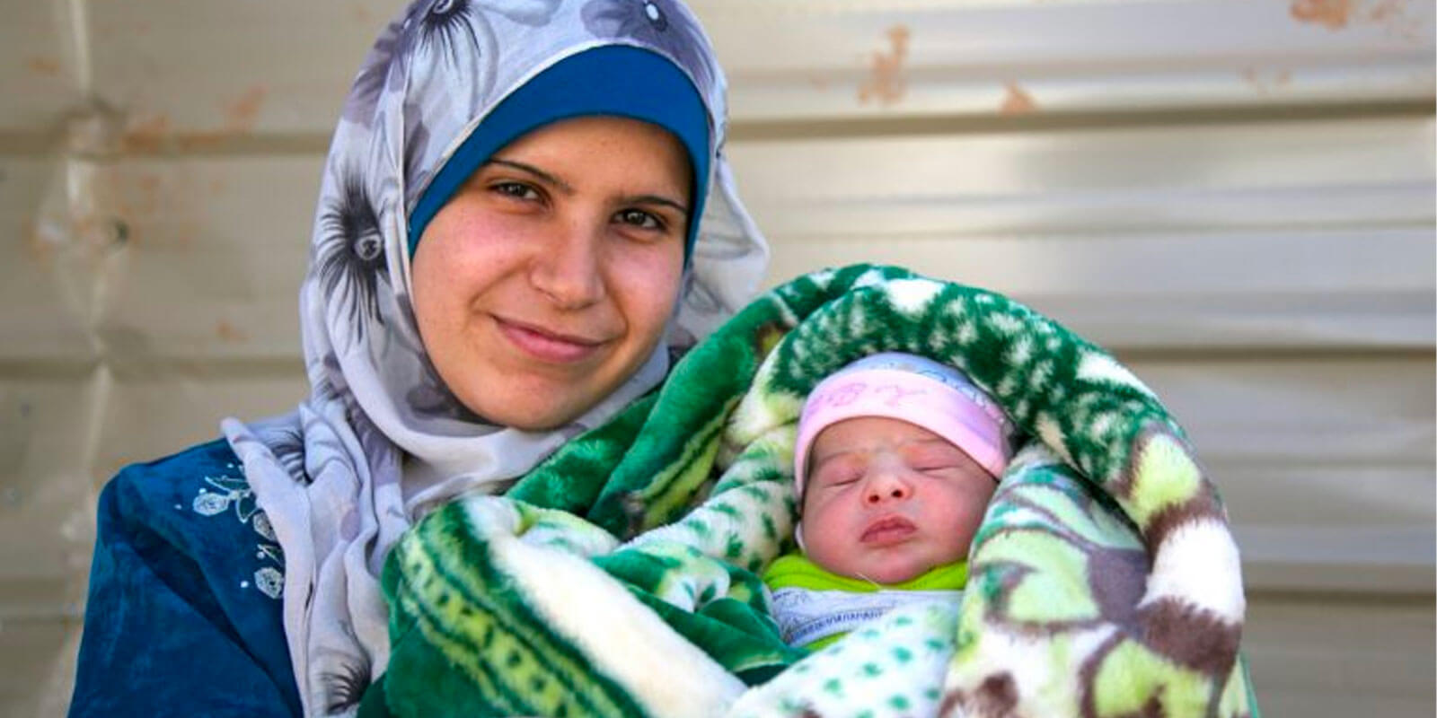 A photograph of a refugee mother and her child