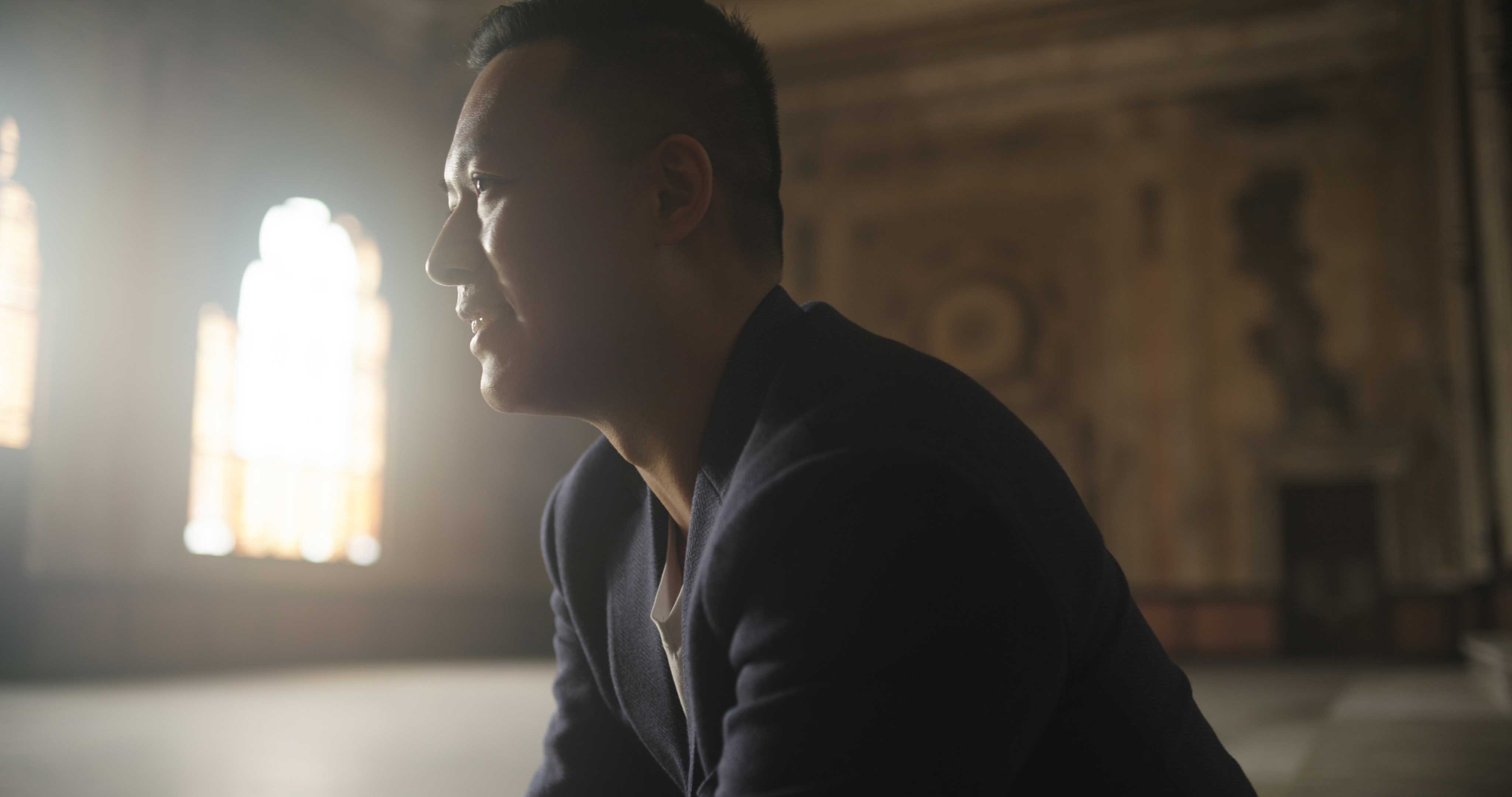 Portrait of Jason Wang with light shining through the windows