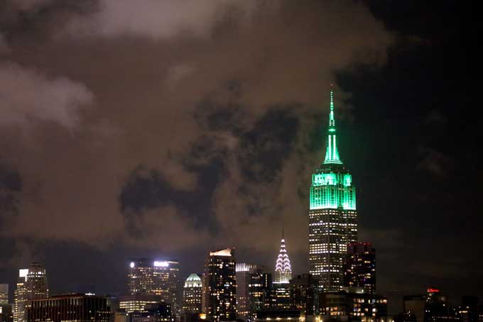 The Empire State Building, lit up green