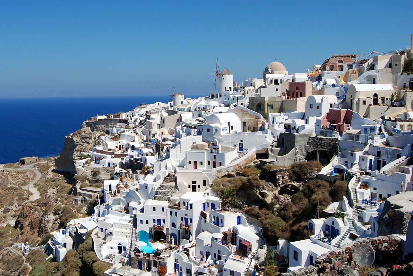 Aerial view of traditional architecture in Santorini, mostly whitewashed