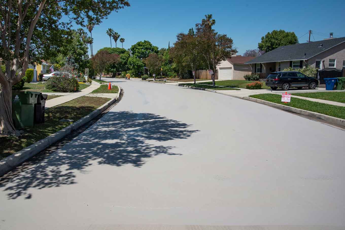 A street painted white to reflect the sun in a neighborhood in California