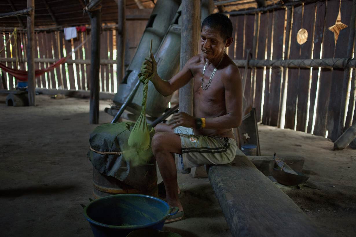 An Indigenous man prepares powdered coca leaves used in the age-old mambe ritual, Puerto Libre riverside community, Amazonas province, Miriti- Parana, Colombia