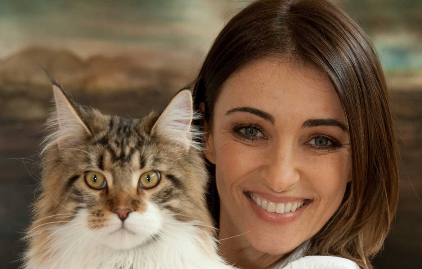 Celebrity veterinarian Katrina Warren smiling with a cat