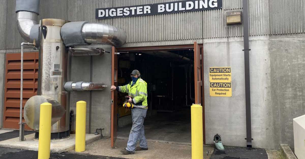 A worker walking through the doors of Clackamas County's Water Treatment Facility