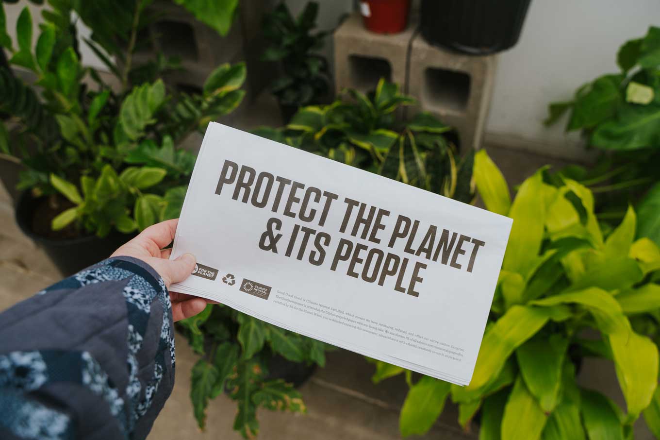 Goodnewspaper reads: Protect the Planet & Its People - with logos for 1% for the Planet and Climate Neutral
