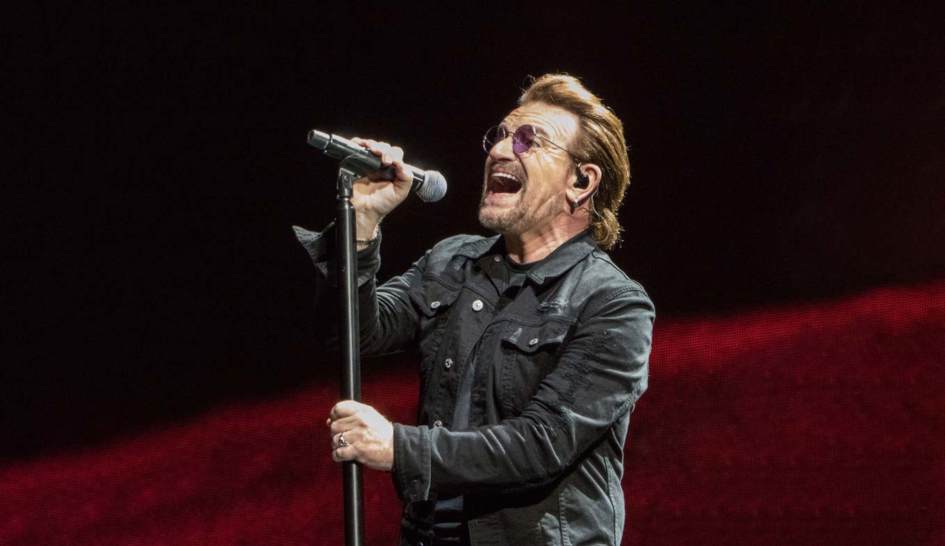 Bono singing during U2's performance at Lucas Oil Stadium