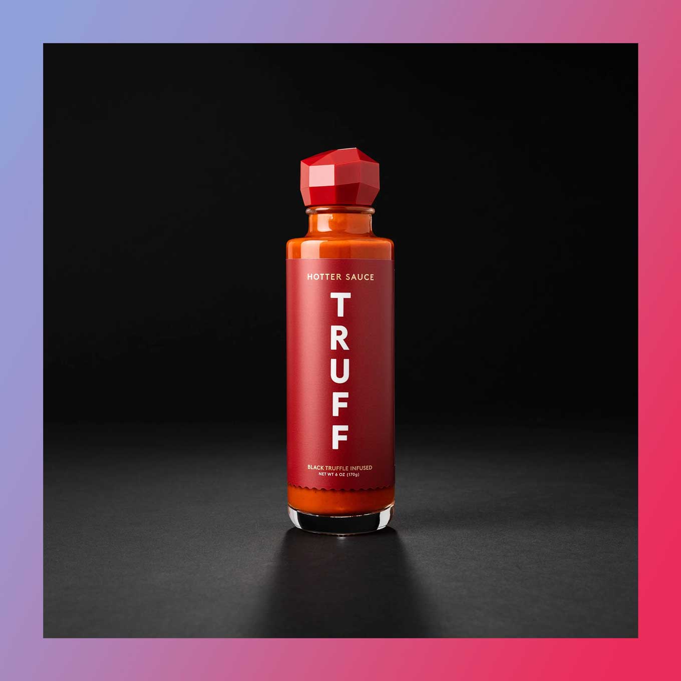Tall bottle of hot sauce that says TRUFF