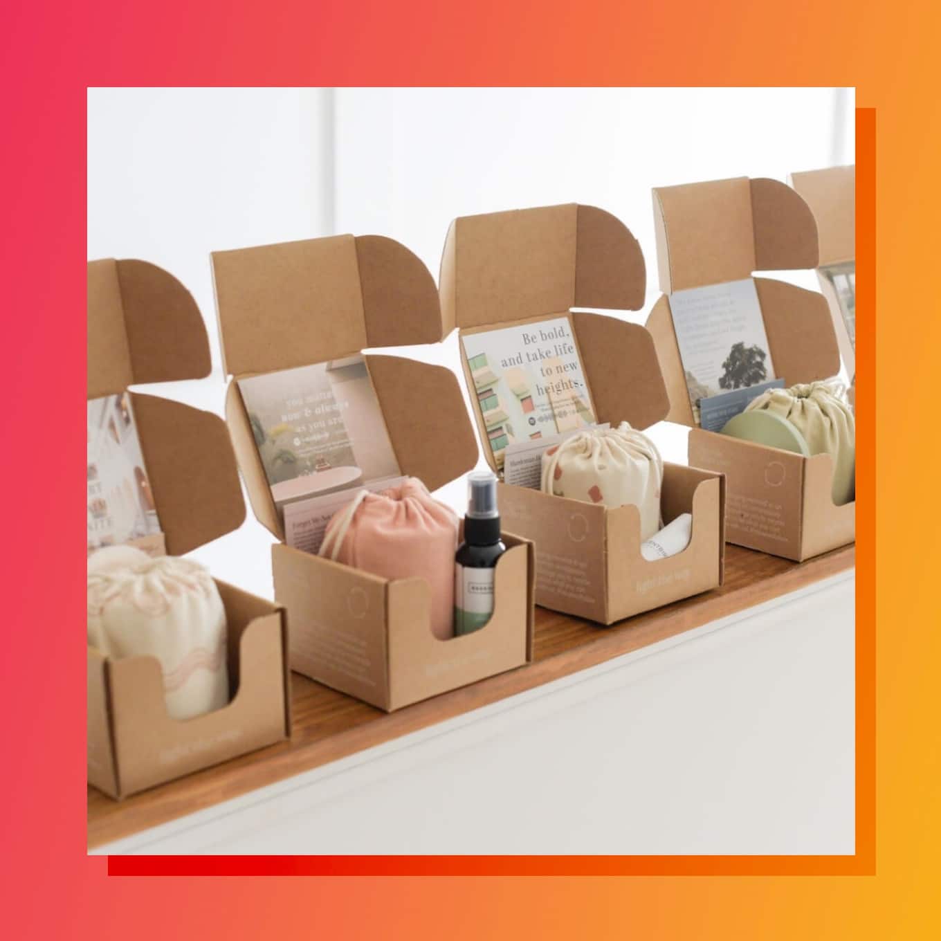 Several cardboard boxes with wrapped candles and other products