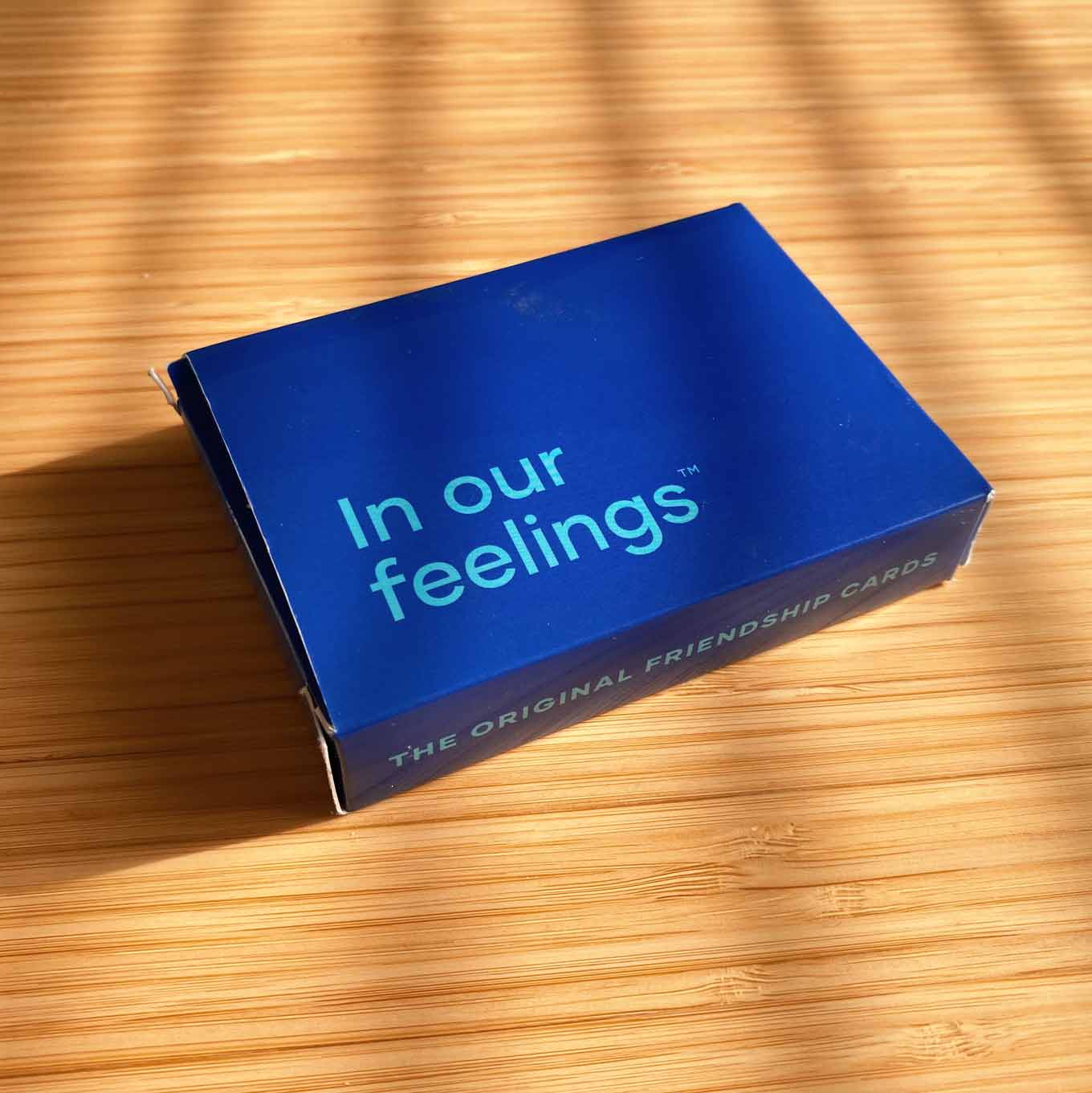 Blue box for a deck of cards, with the words In Ou Feelings: The Original Friendship Cards