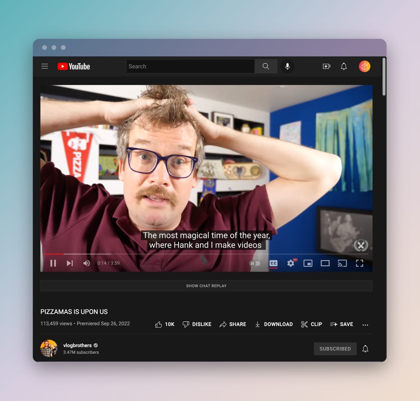 John Green sports a mustache on his YouTube channel, while the closed captioning says, "The most magical time of the year, where Hank and I make videos"