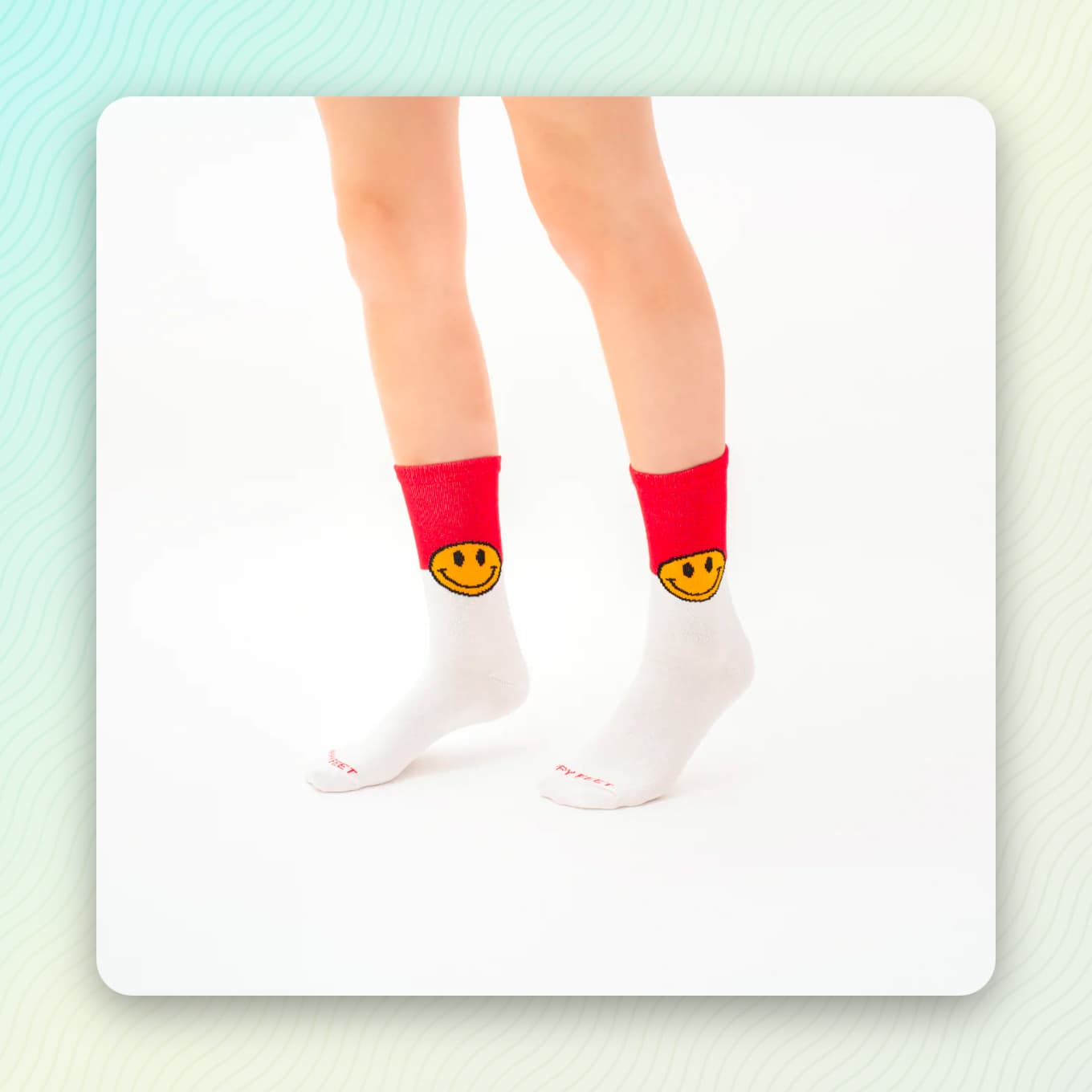 White and red socks with yellow smiley faces on them