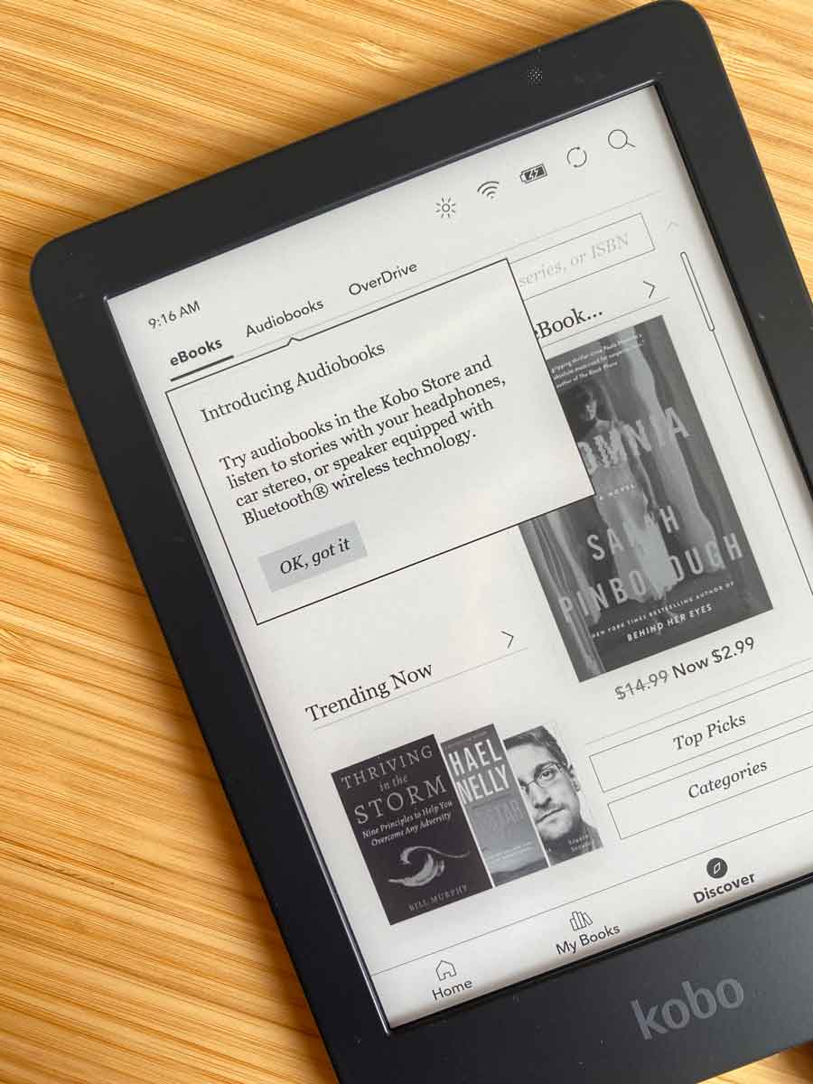 Kobo Clara 2E with the text: Introducing Audiobooks - Try audiobooks in the Kobo Store and listen to stories with your headphones, car stereo, or speaker equipped with Bluetooth wireless technology