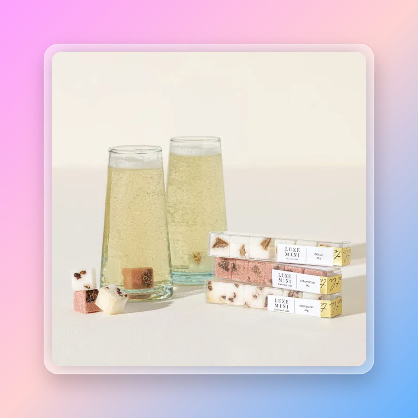 Box of sugar cubes next to glasses of mimosas