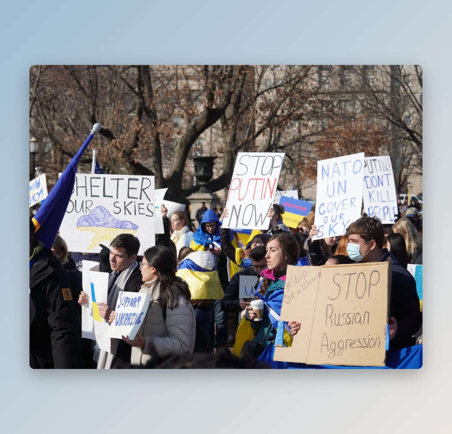 People hold signs in support of Ukraine in USA