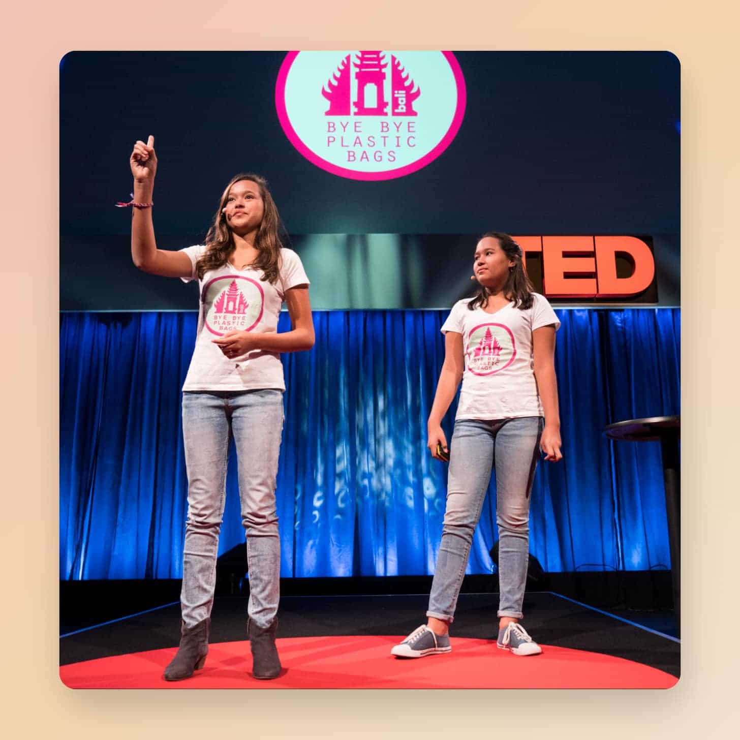 Melati and Isabel Wijsen on stage at TED with a screen that says Bye Bye Plastic Bags