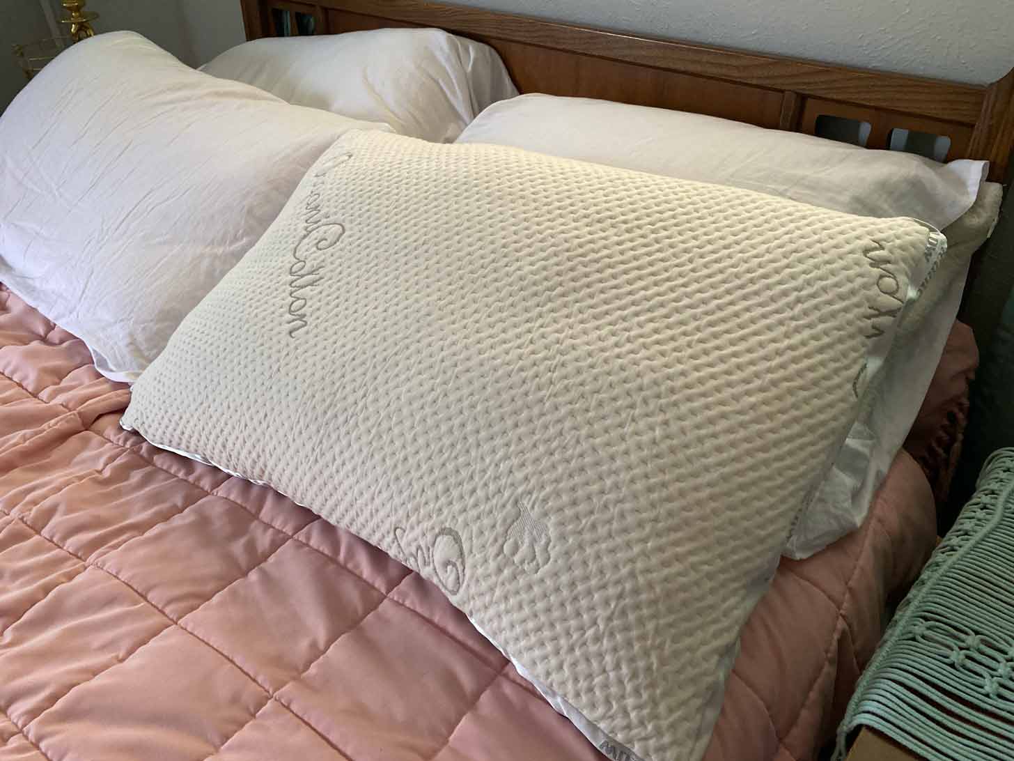 A Nest Bedding pillow on a bed