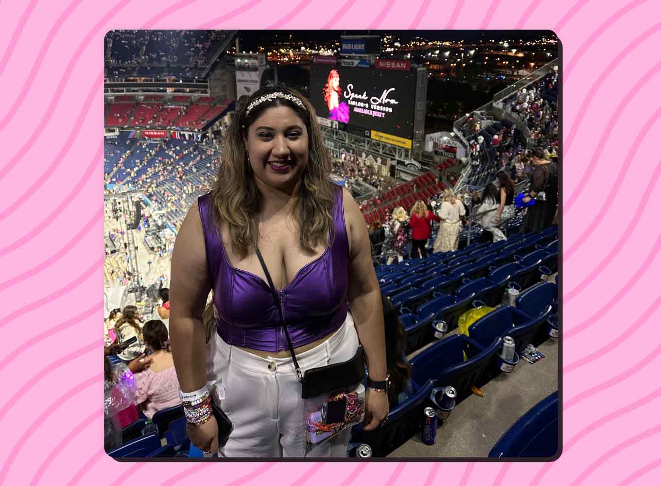 Alyssa Monreal wears a purple tank top and sparkly headband at the Eras Tour