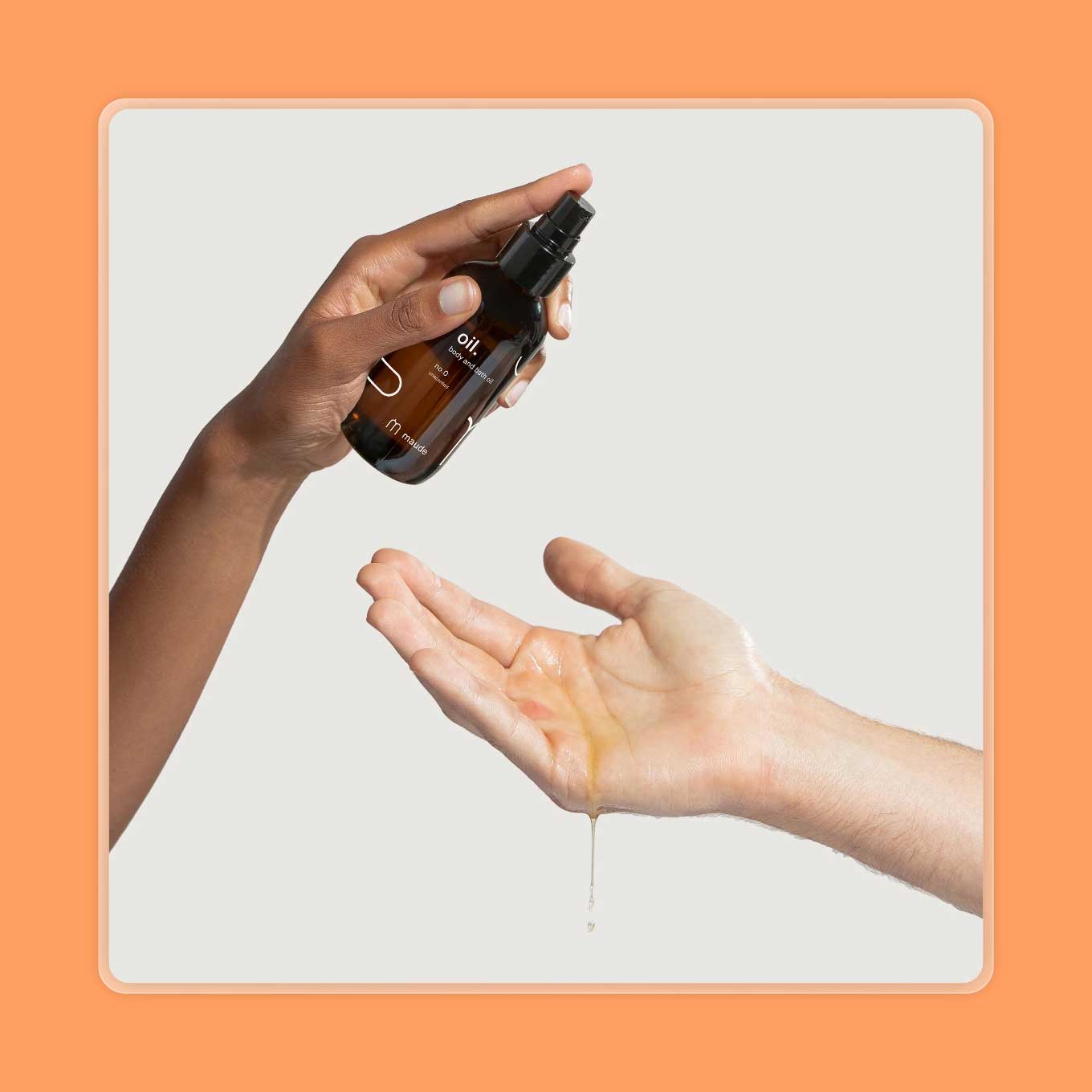A hand pours maude massage oil into another hand