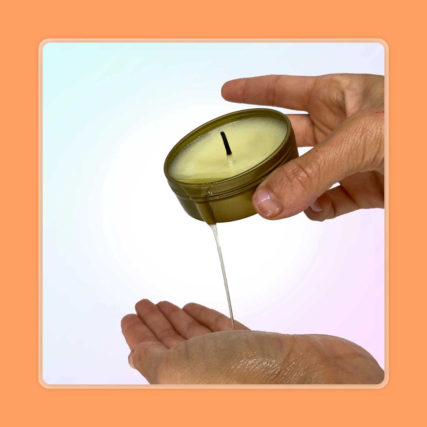A hand pours wax from a massage candle into another hand