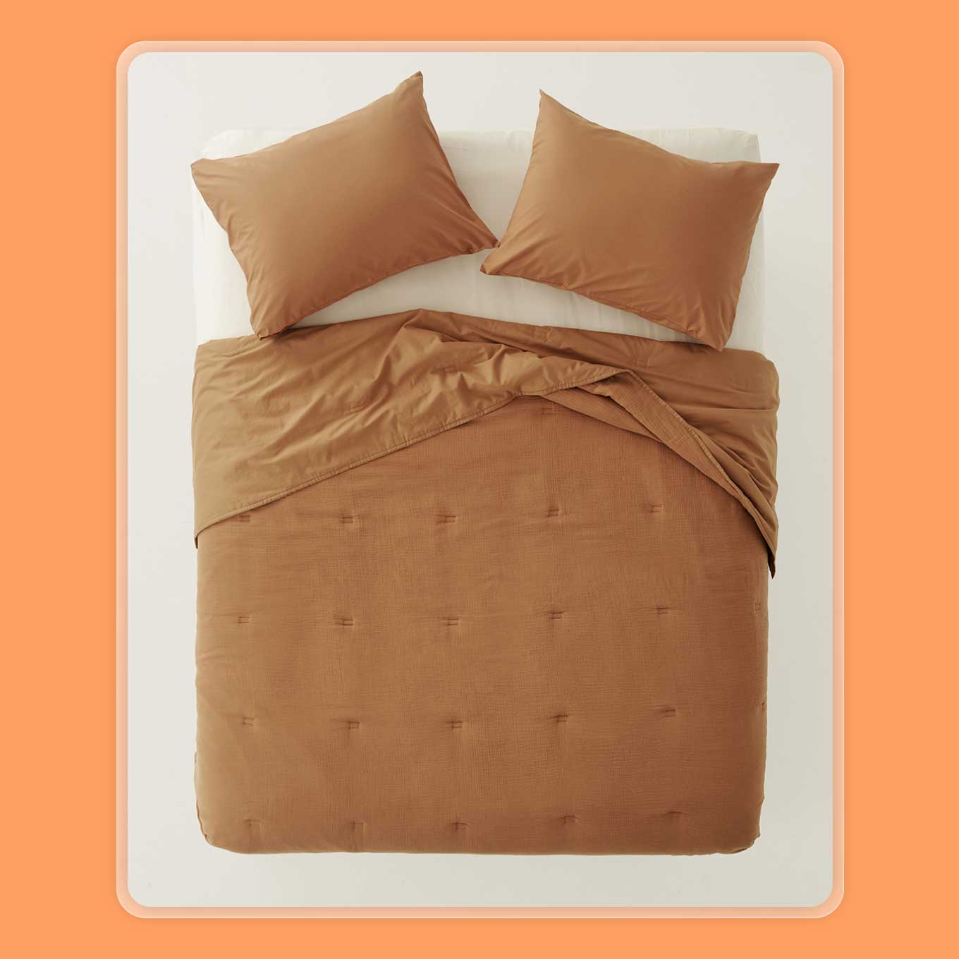 Brown quilted comforter on a bed
