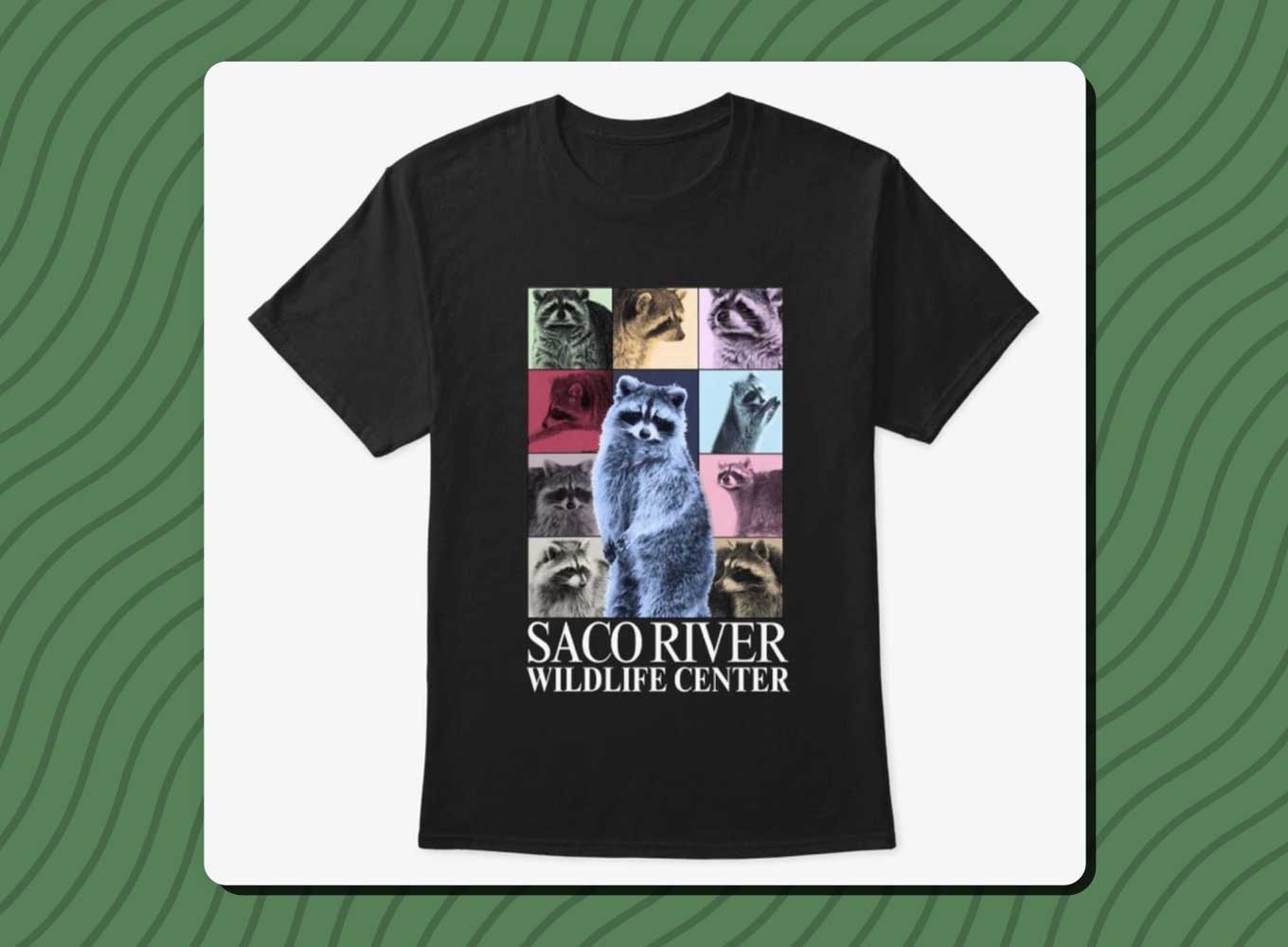 A black t-shirt with various raccoons on it. Saco River Wildlife Center