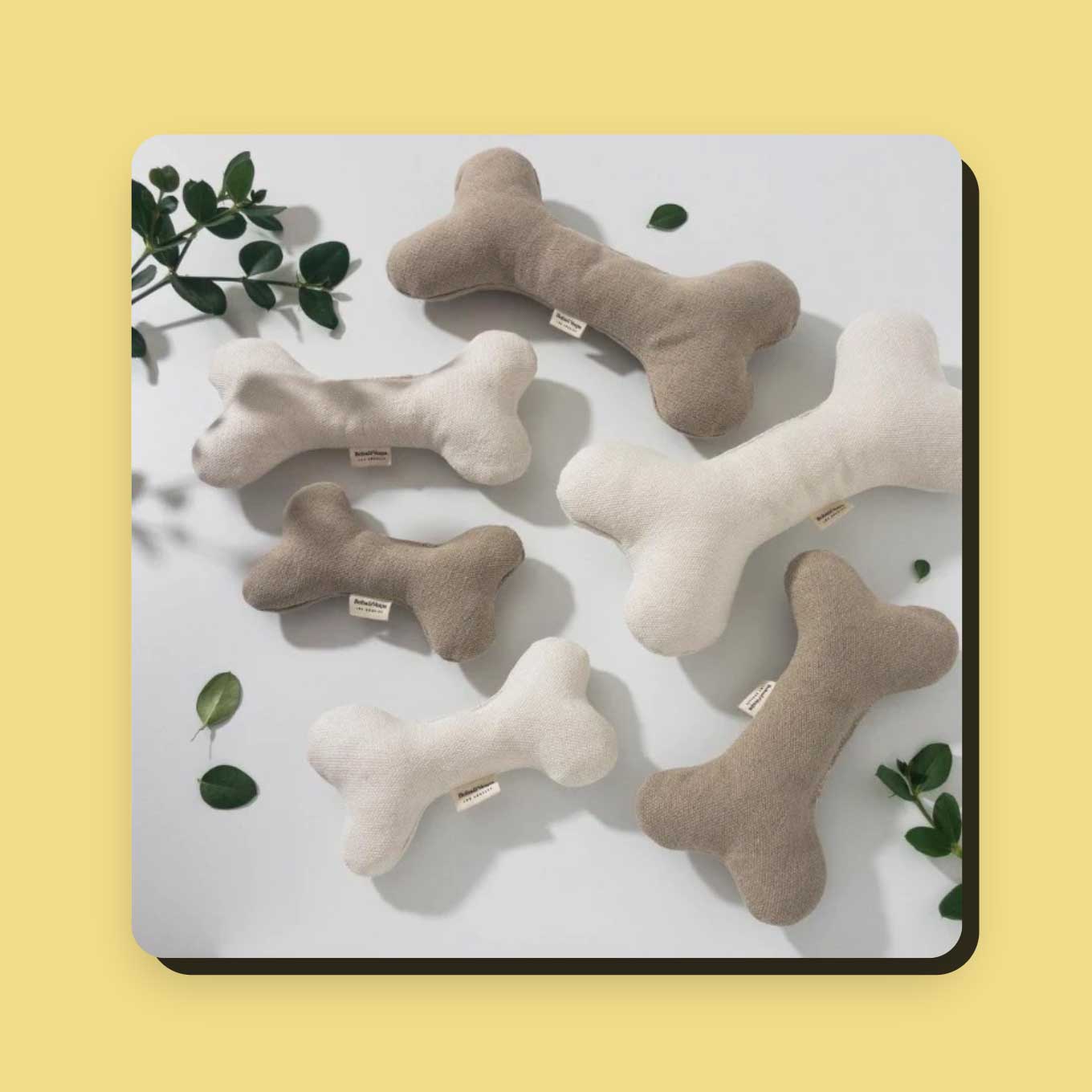 A variety of dog-bone shaped plush toys