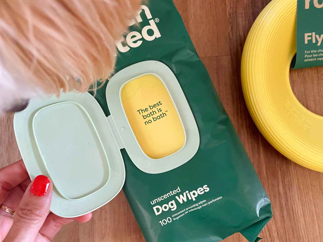 A pack of Earth Rated dog wipes reads "The best bath is no bath."