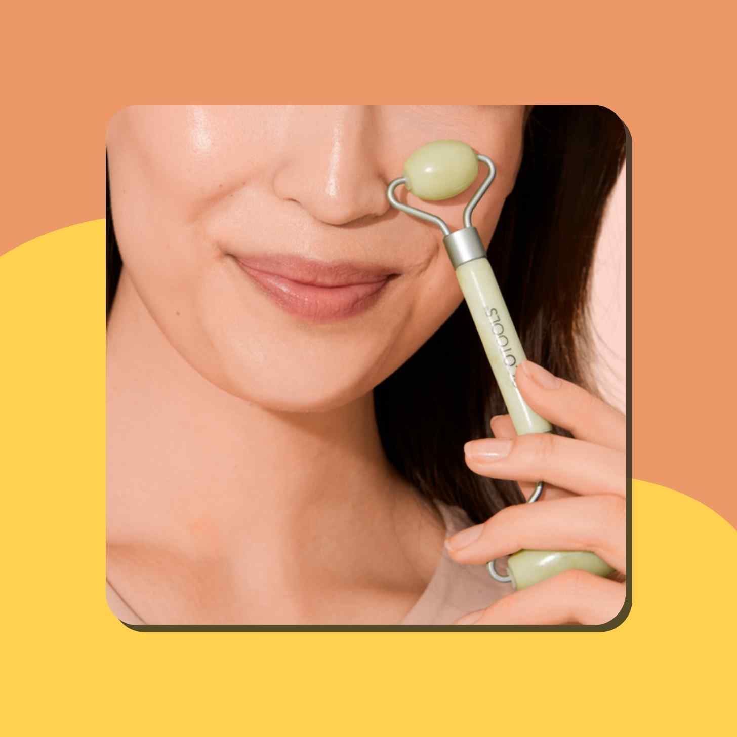 A Person Using A Jade Facial Roller On Their Skin