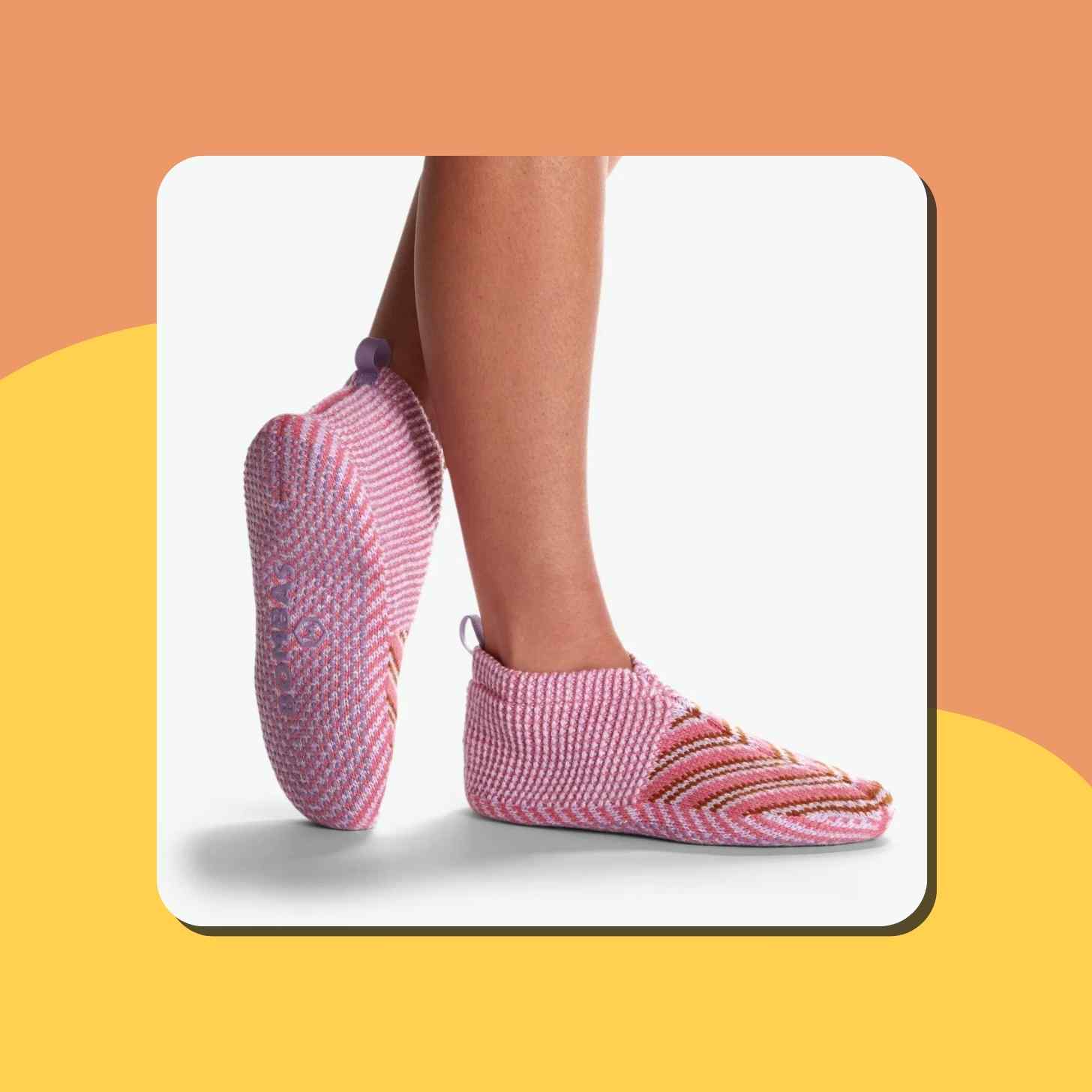 A Person Wearing A Pair Of Pink Bombas Gripper Slippers