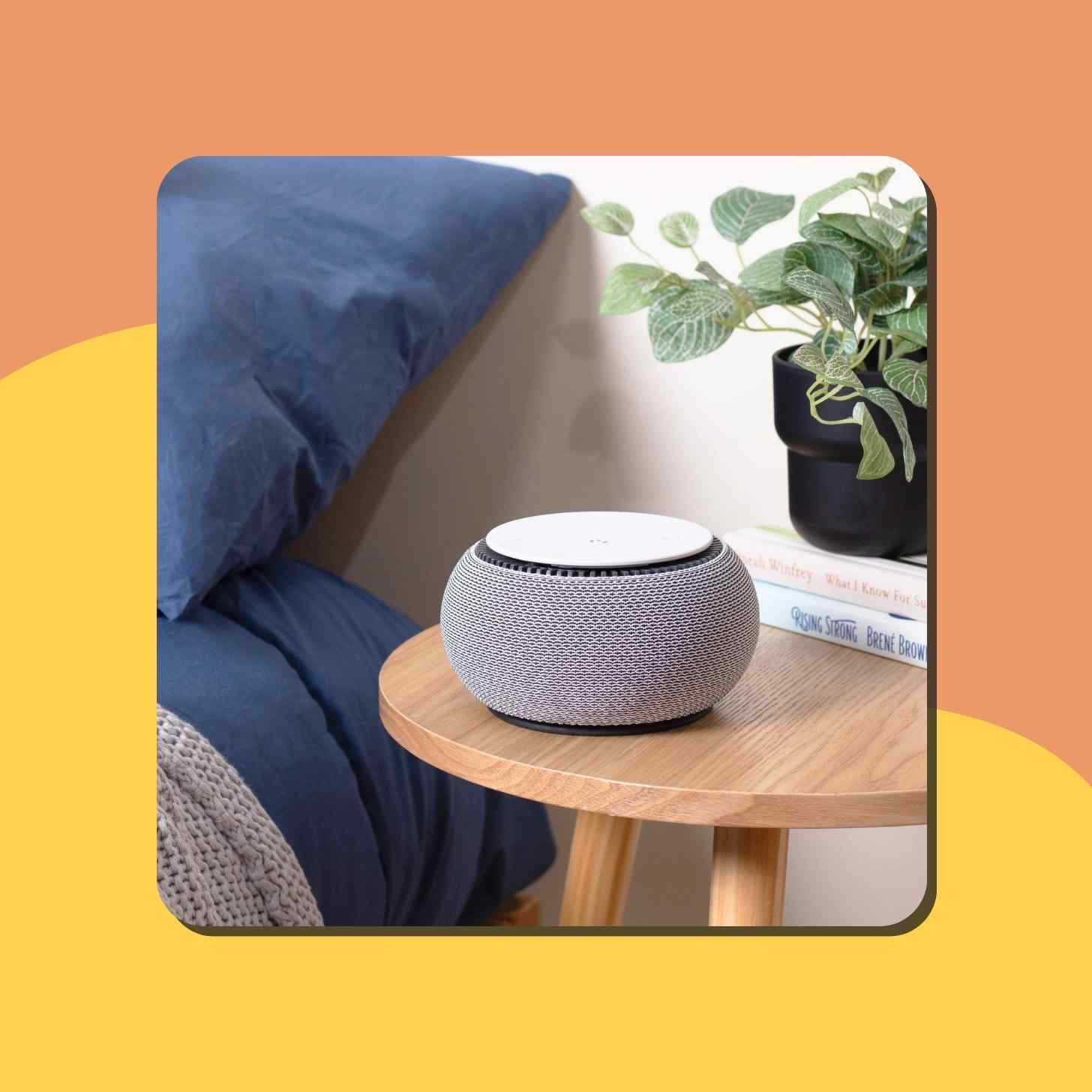 A Soothing Sound Noise Machine Resting On Top Of A Nightstand