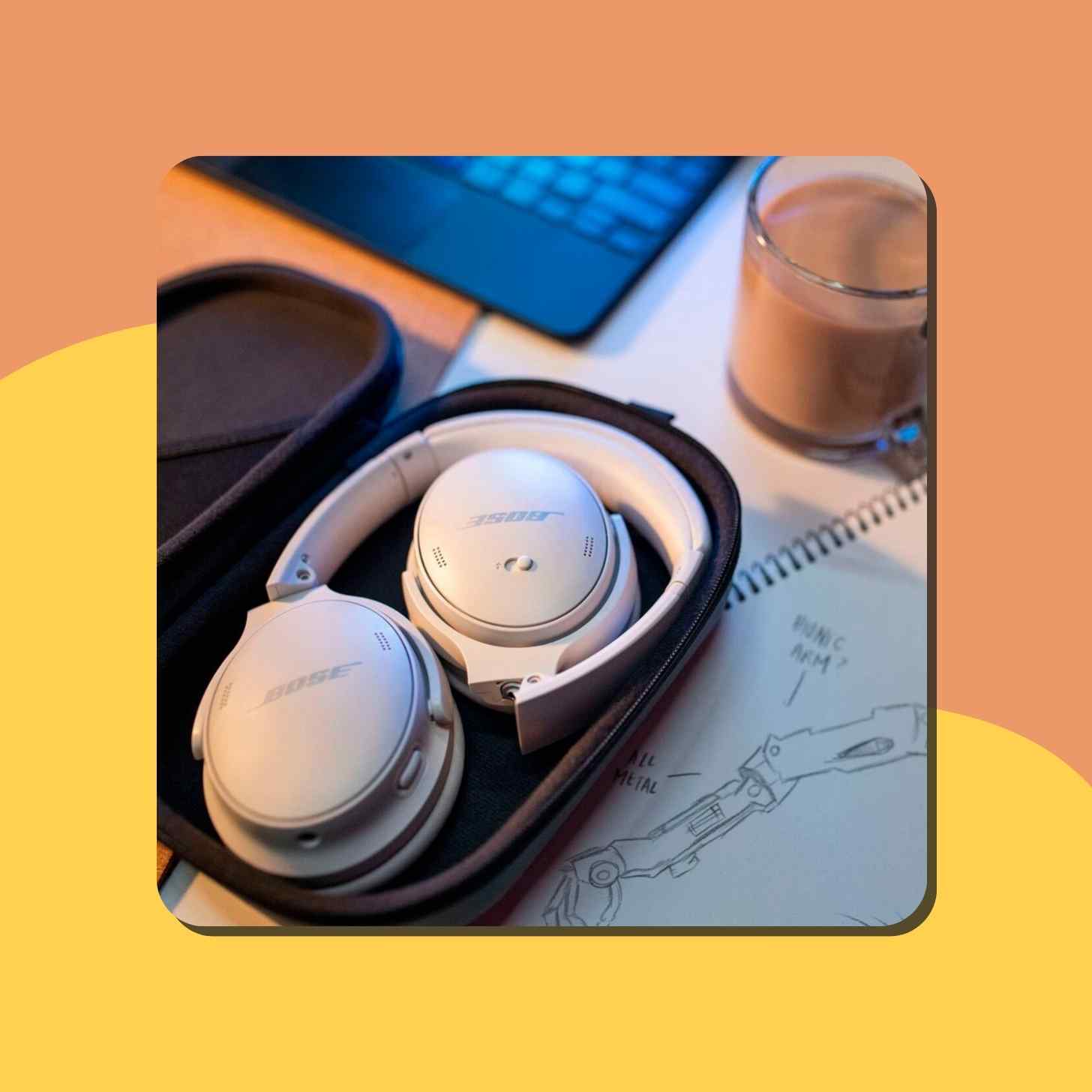 A Pair Of Bose QuietComfort Headphones Sitting In A Case On A Table Next To A Cup Of Coffee