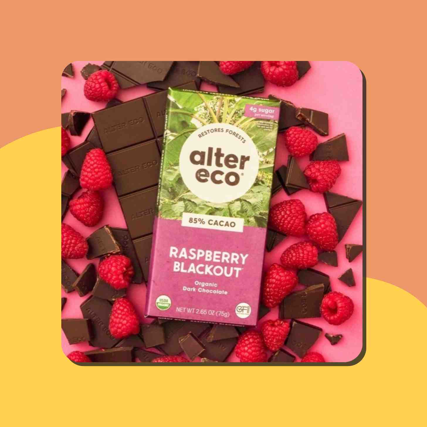 A Box Of Alter Eco 85% Cacao Raspberry Blackout Flavored Sitting On Top Of Its Chocolate And Berries