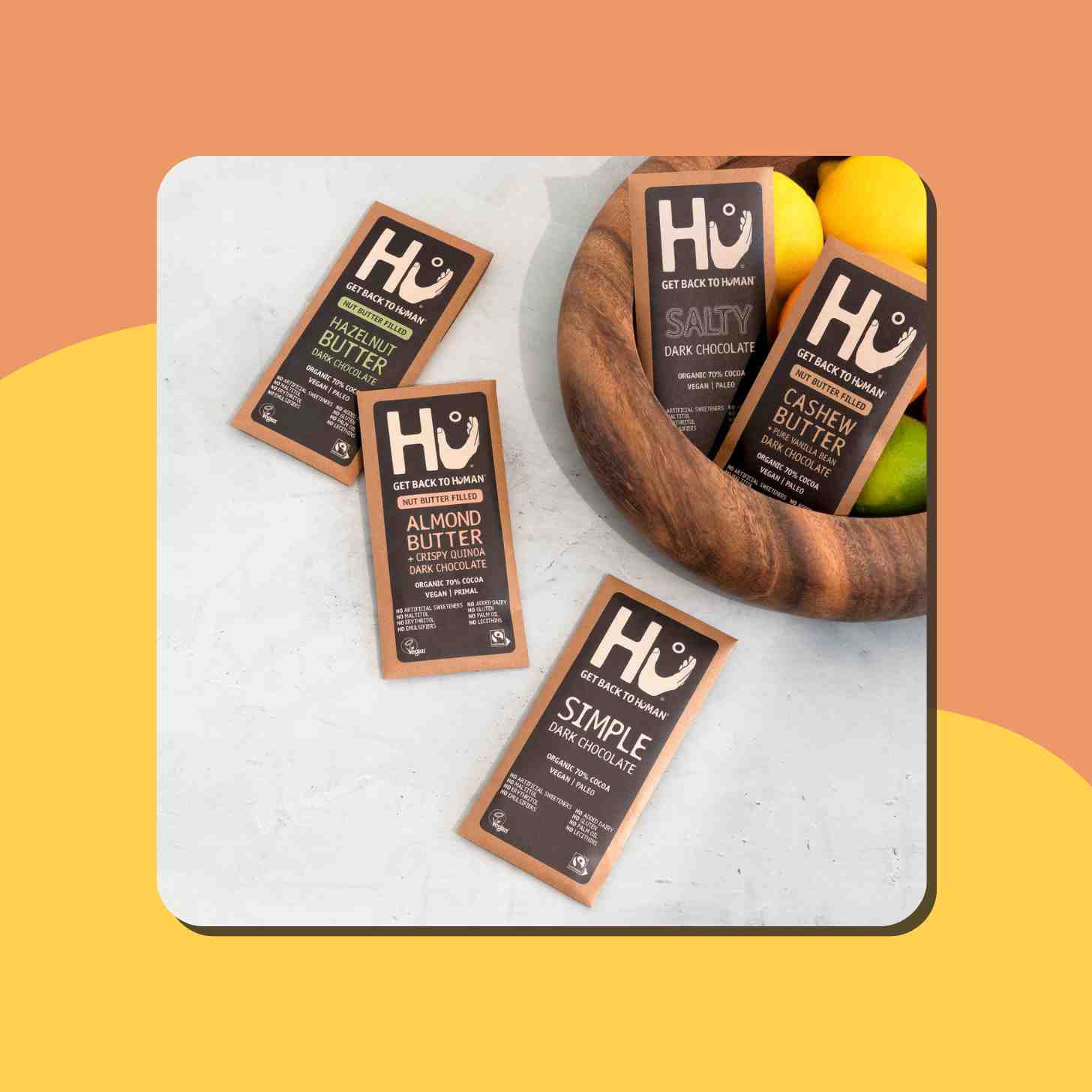 Five Packages Of Hu Kitchen Chocolates, They All Have Different Flavors.