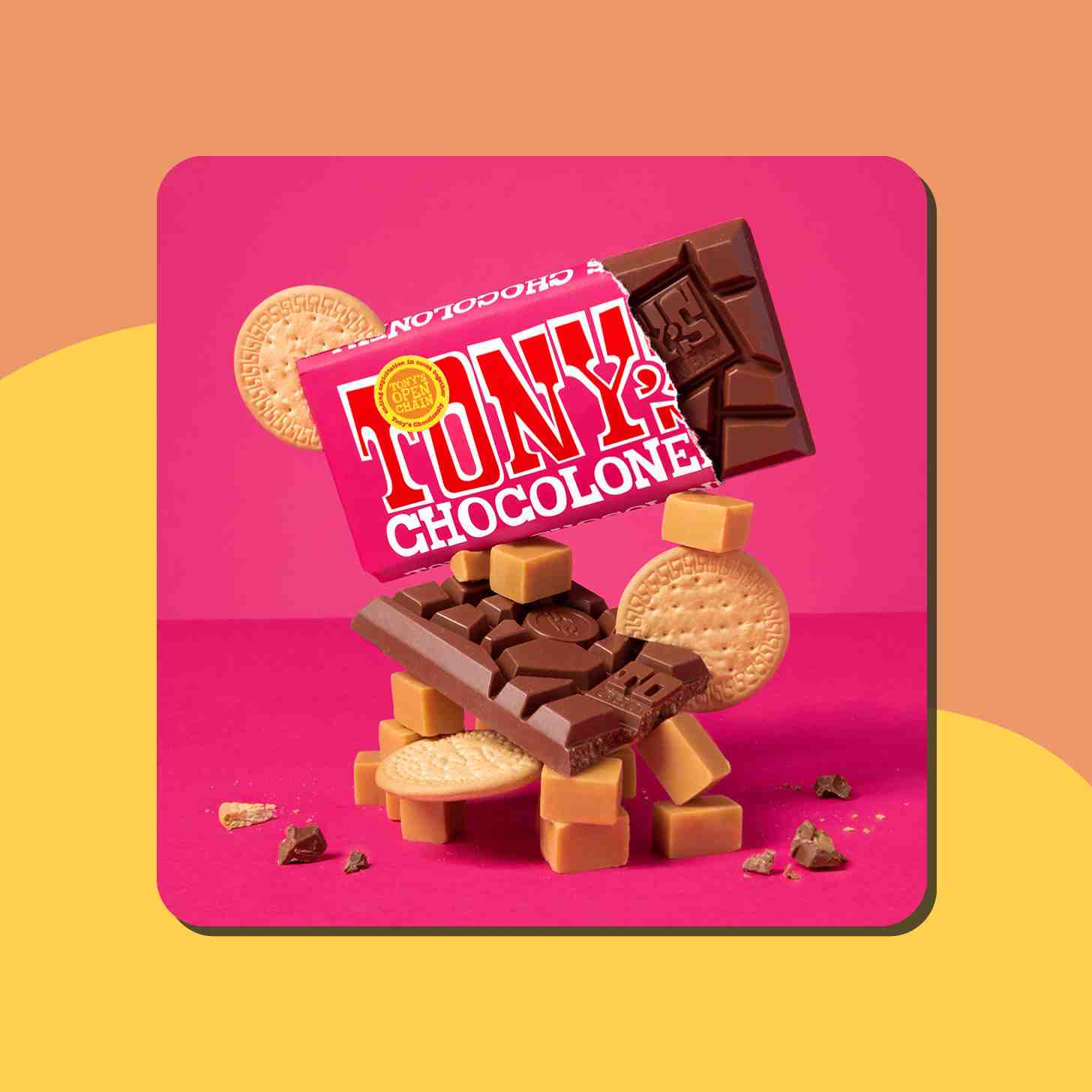 A Box Of Tony's Chocolonely Chocolate Bar Resting On Top Of Some Cookies And A Chocolate Bar